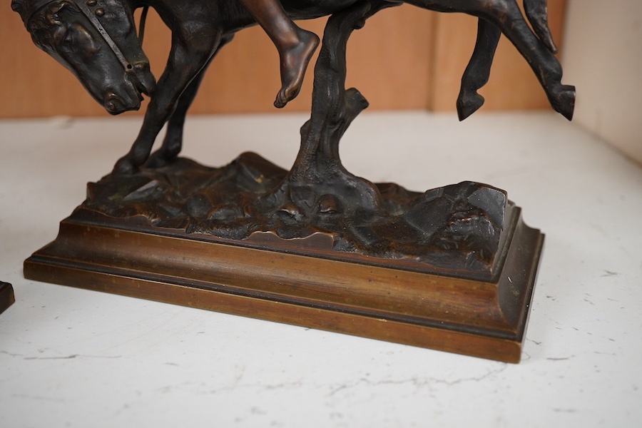 After Paul Aichele (1859-1910), a pair of bronze figures of Arab boys riding donkeys, 23cm